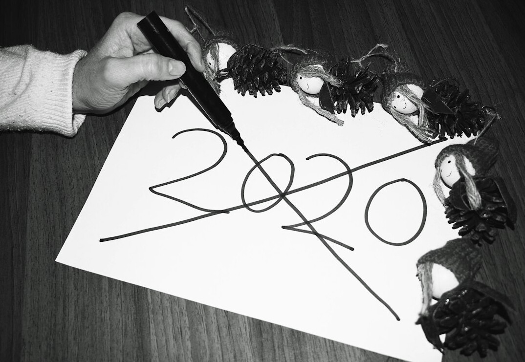 Hand signing a paper document with a pen